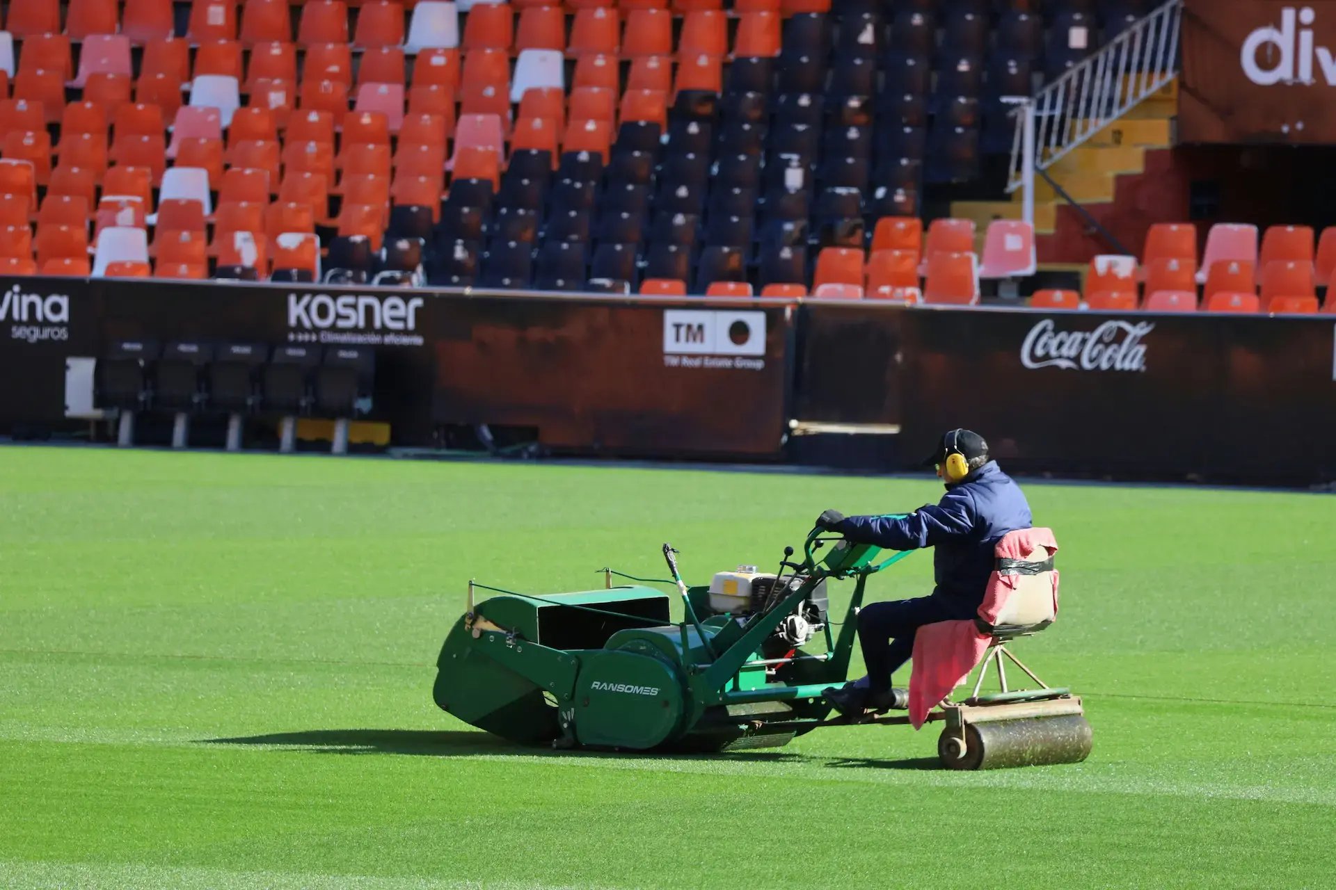 Heavy duty mowing machine in stadium