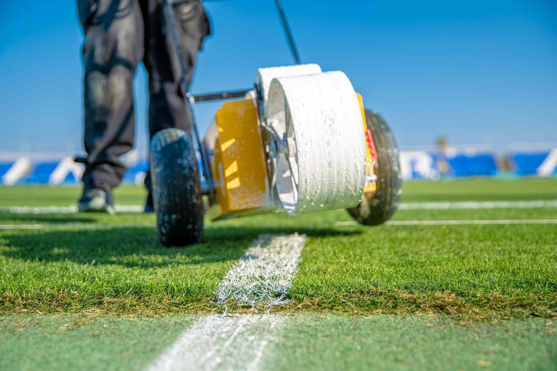 lining-a-football-pitch-using-white-paint-on-grass